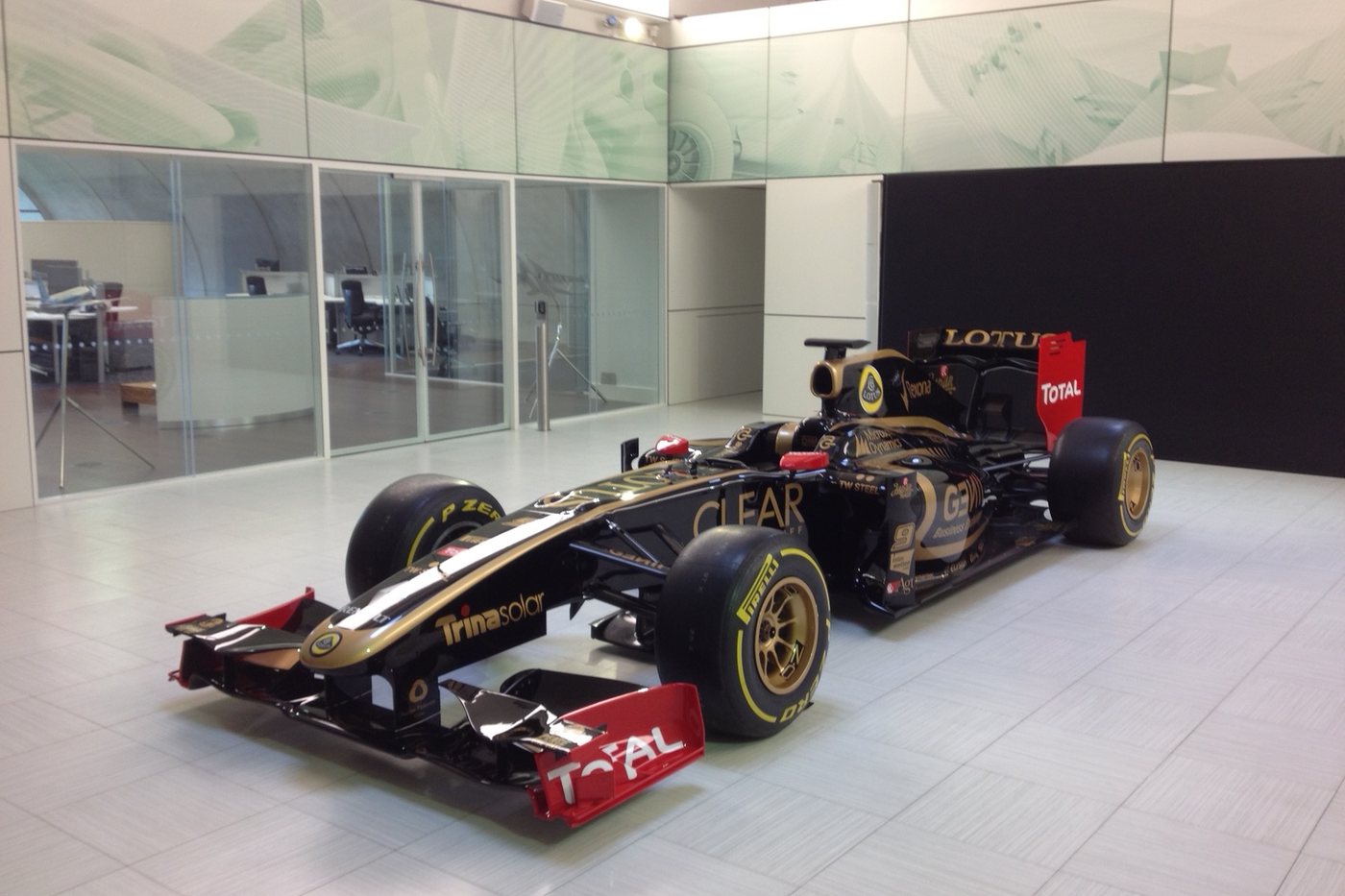 Black and gold Lotus Formula 1 car in the Enstone reception