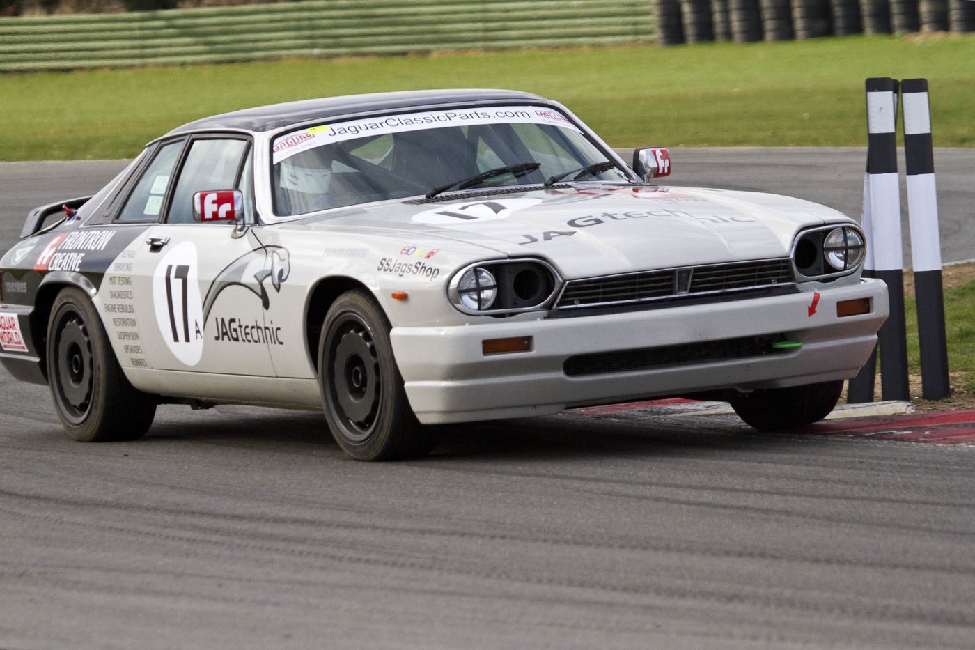 White Jaguar XJS race car, number 17, cornering on track