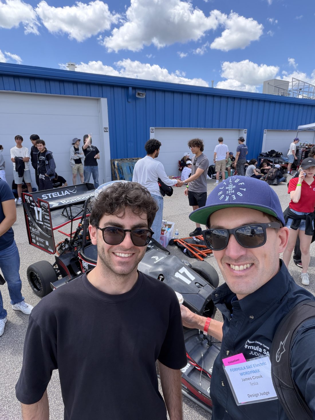 James Crook with a student at FSAE Electric, Michigan International Speedway