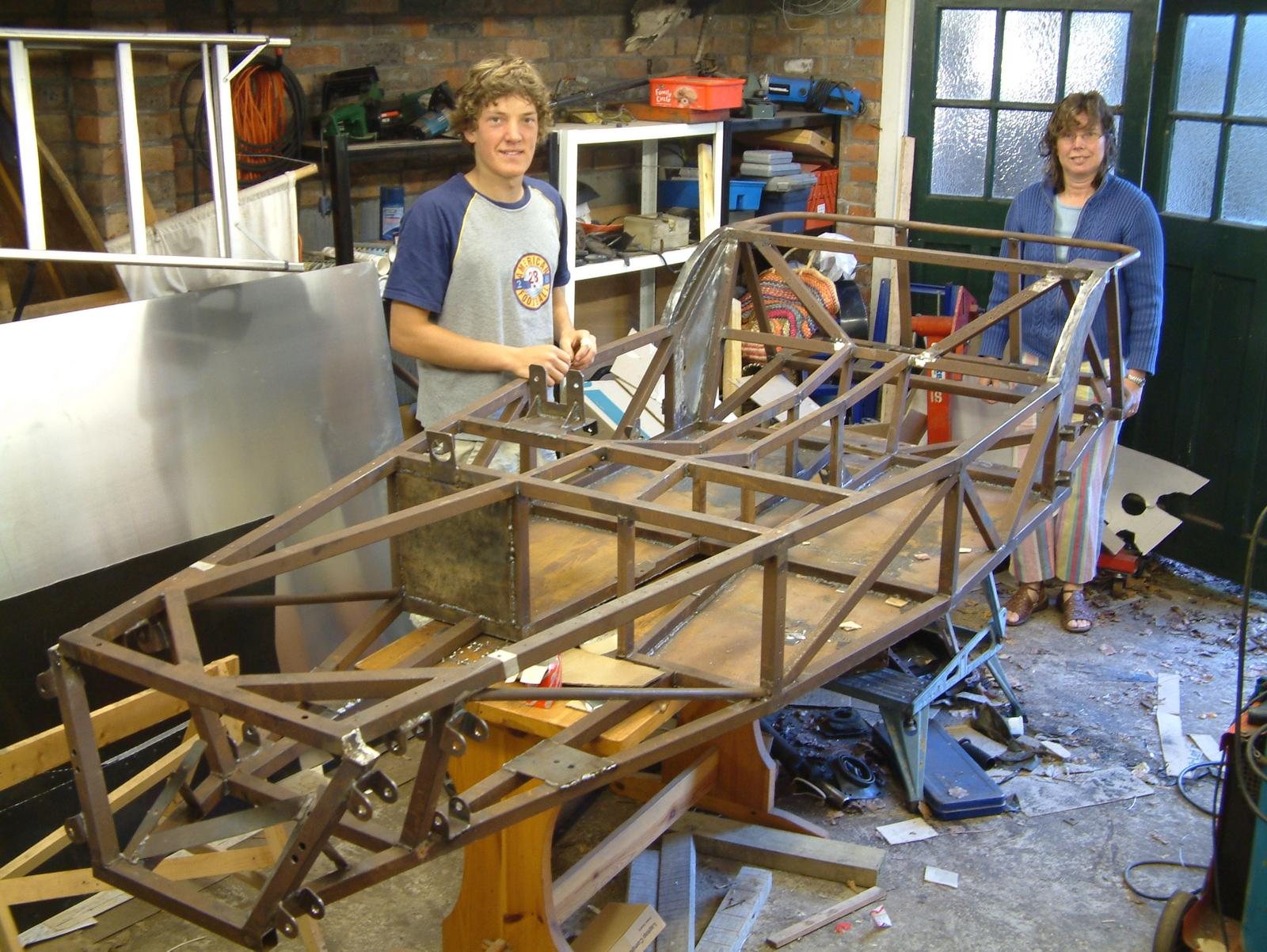 The Locost's bare steel frame in the garage